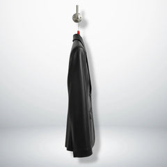 Side profile of hip‑length black leather blazer for women