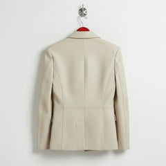 Back view of tailored women’s white leather blazer