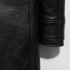Detail of sleeve and grainy black leather texture on Bane style coat.