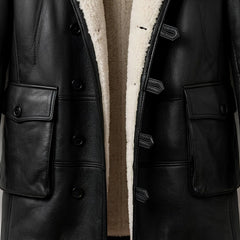 Front pocket and button closure detail on men’s Bane inspired leather coat