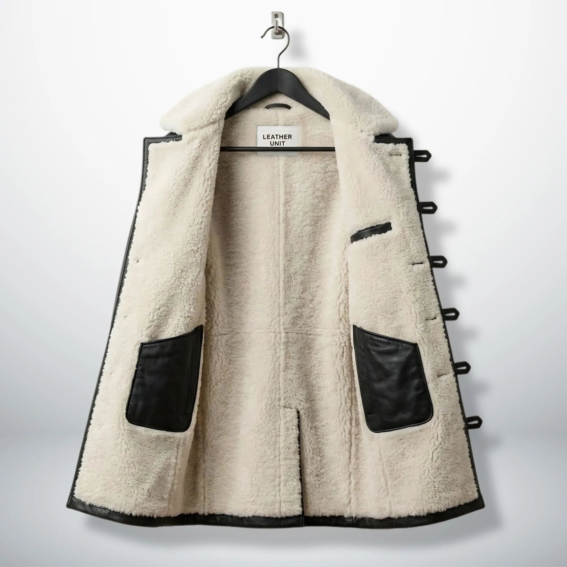 Inside cream sherpa lining of men’s black Bane leather coat