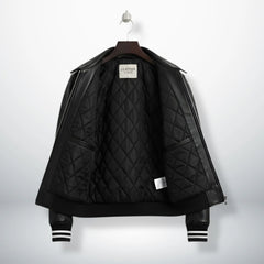 inside view black bomber leather jacket with quilted lining and inner pockets.