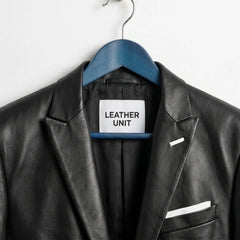 Close up of lapel collar and Leather Unit label on black leather blazer