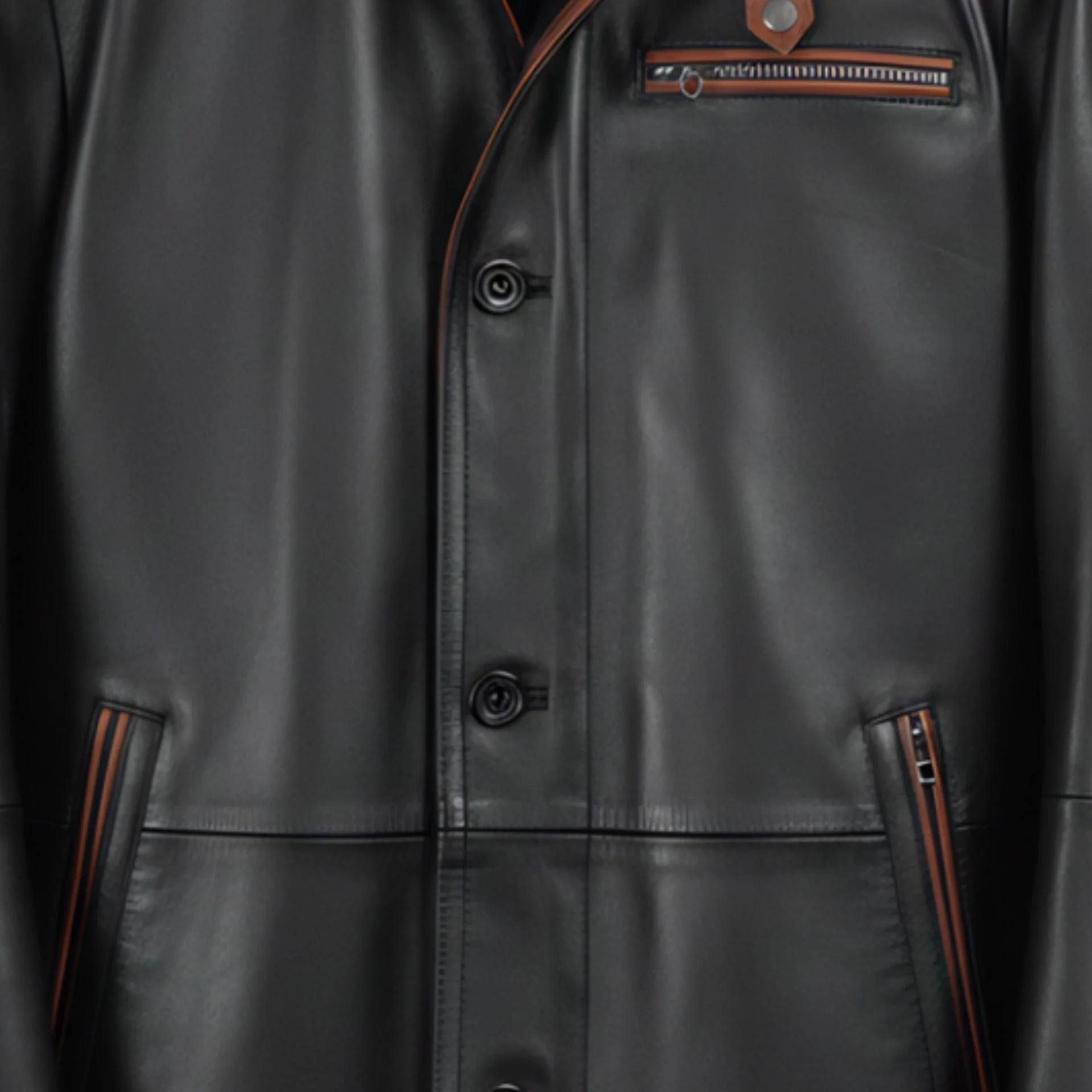 Brown trimmed zip pockets and button placket on men’s black leather coat