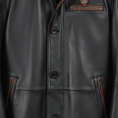 Brown trimmed zip pockets and button placket on men’s black leather coat