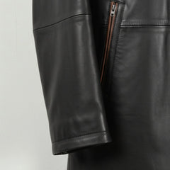 Sleeve and cuff detail on men’s smooth black leather car coat