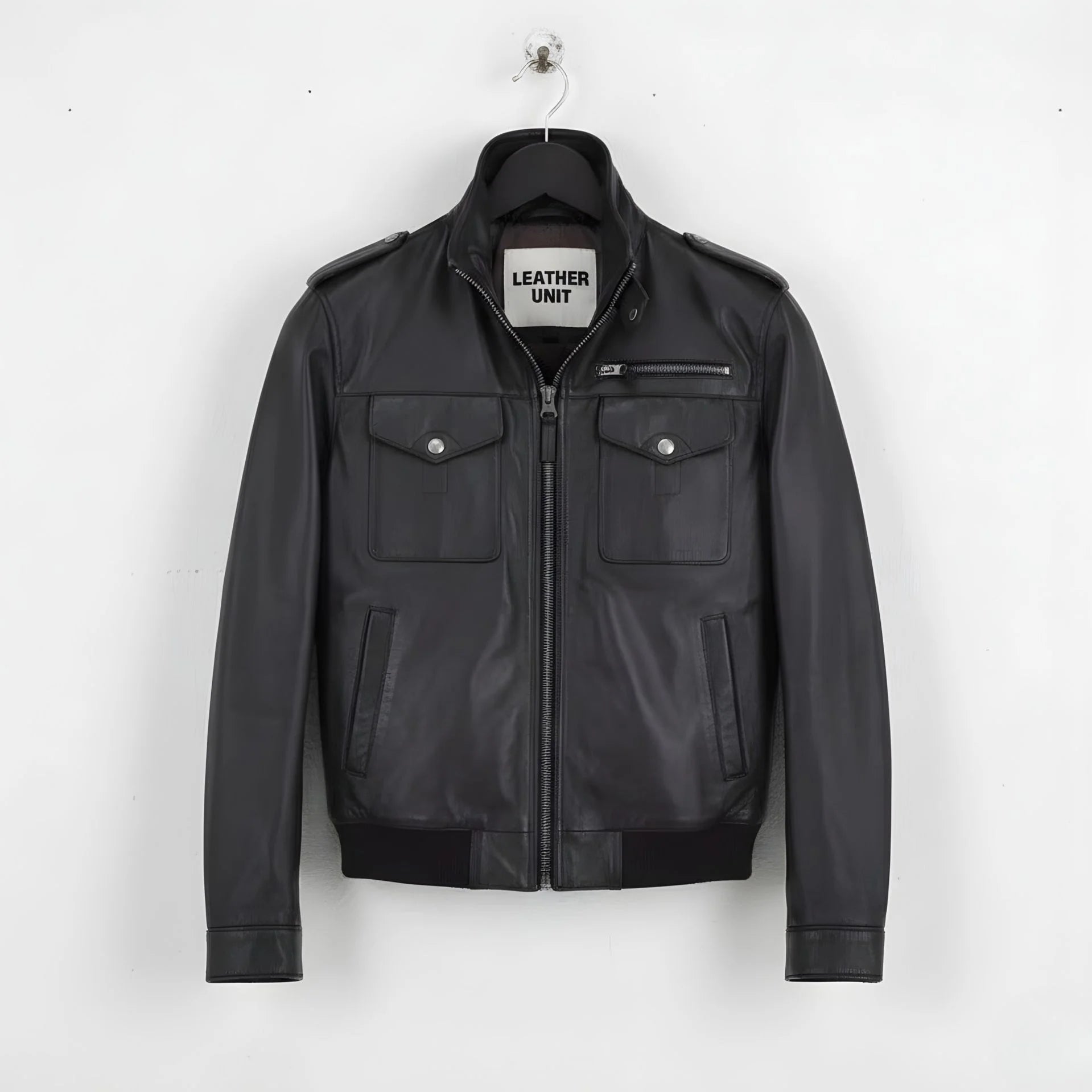 front view of men's black leather field jacket with epaulettes and flap pockets.