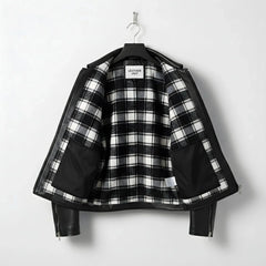 interior of men's black leather jacket showing black and white plaid lining.