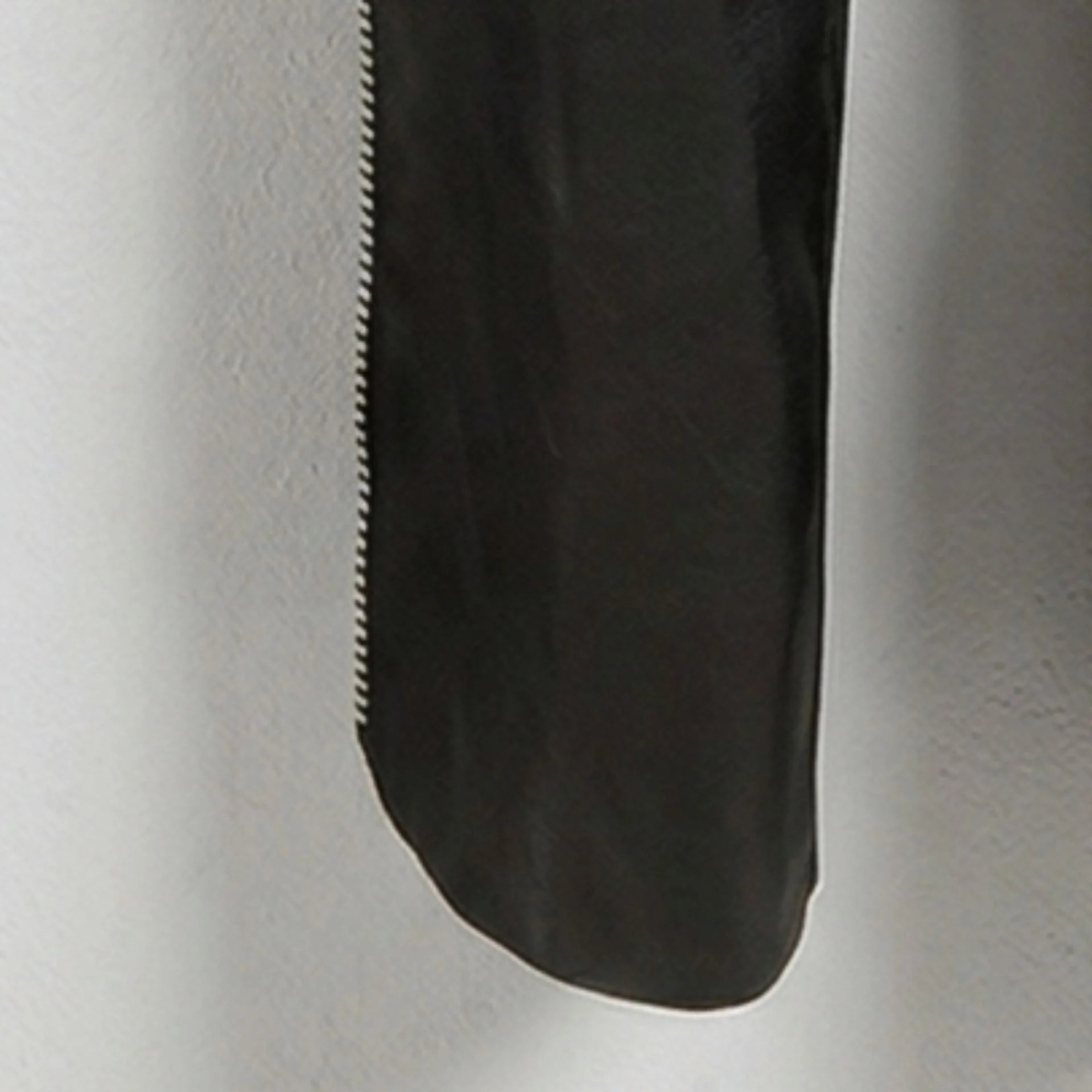 Detail of lower leg and side zipper on genuine black leather chaps