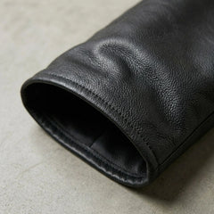 Detail of hem and grain on genuine black leather chaps leg