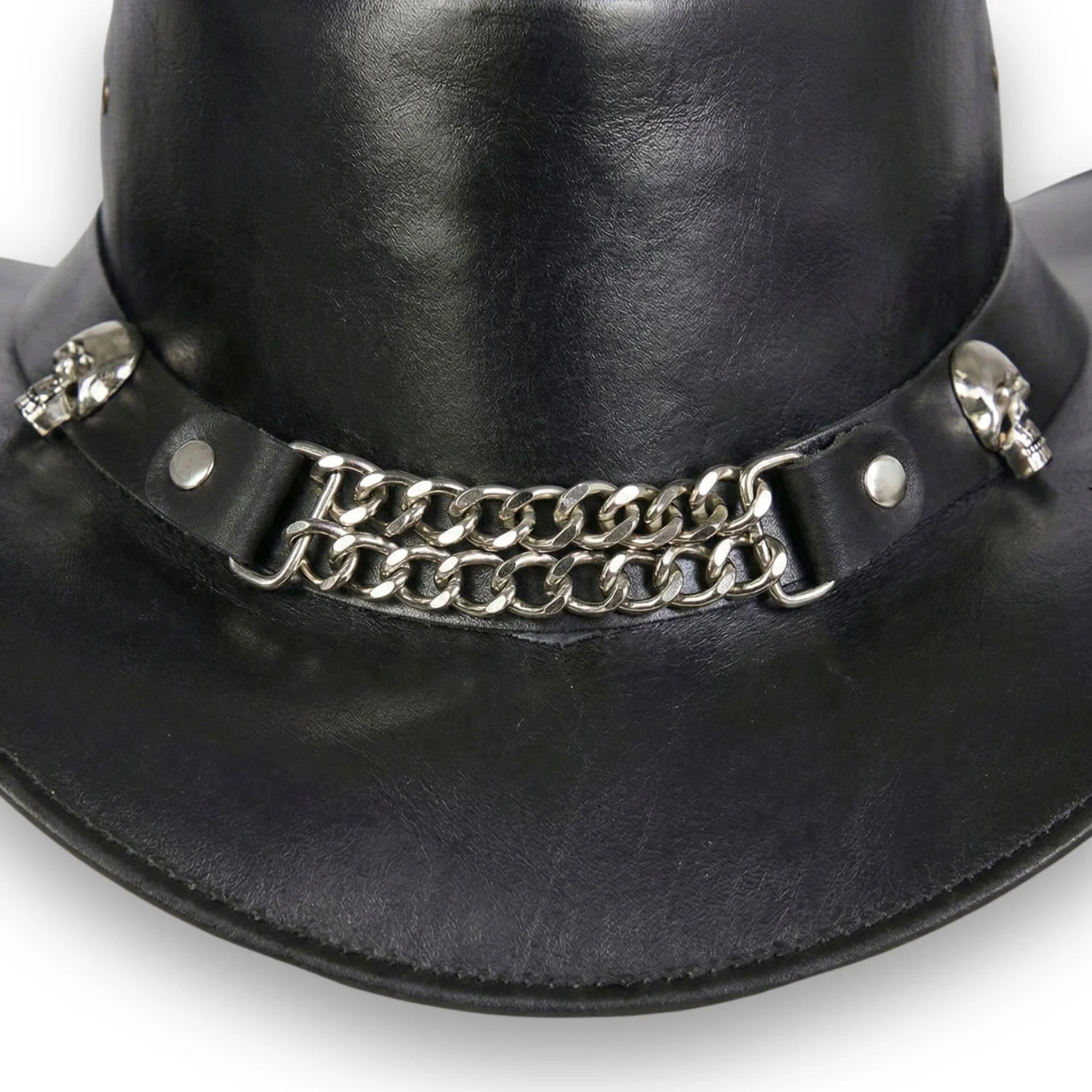 Close-up of chain hatband and skull accents on men's black leather hat
