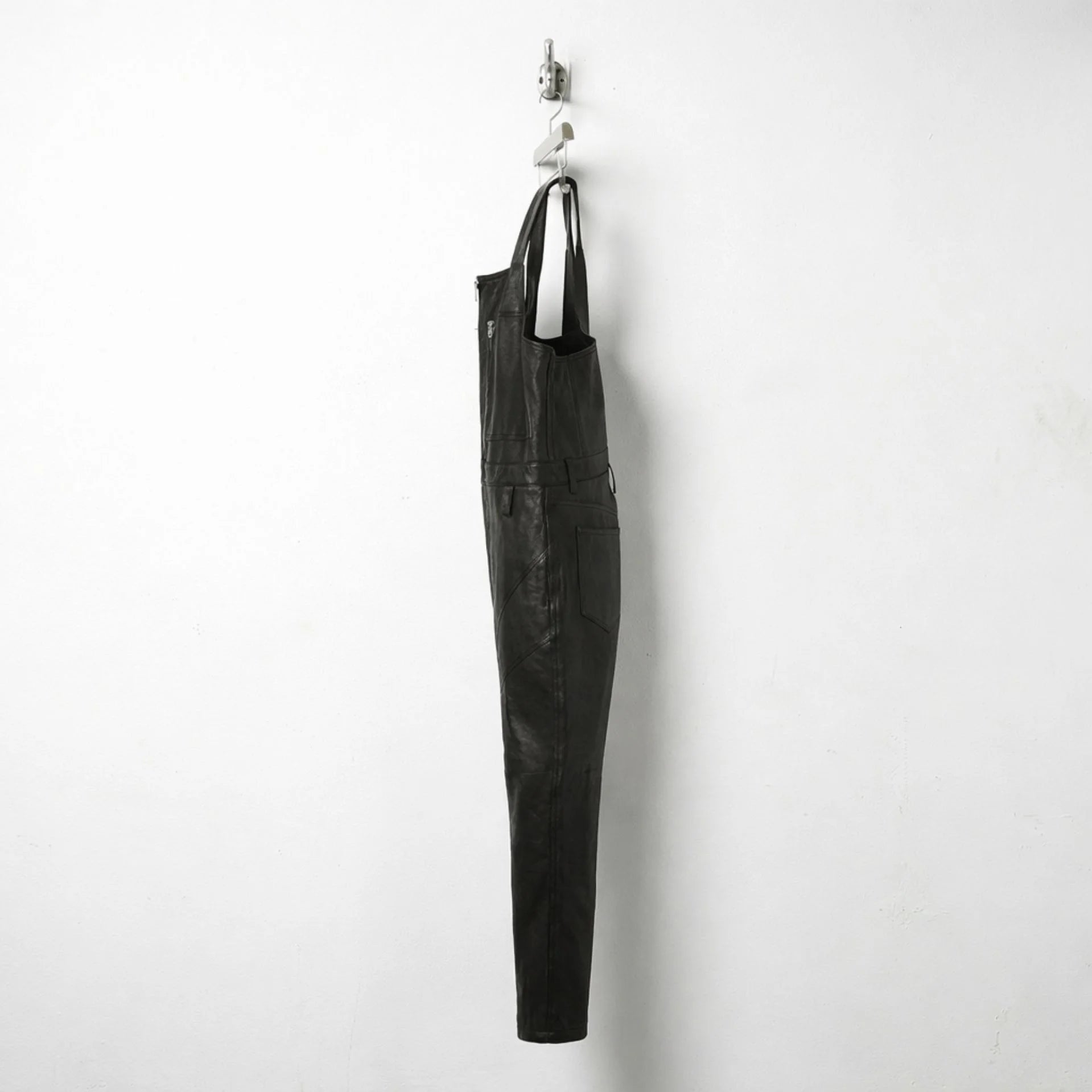 Opposite side view of men's fitted black leather overalls