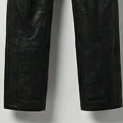 Detail of lower legs and seam design on men's black leather overalls