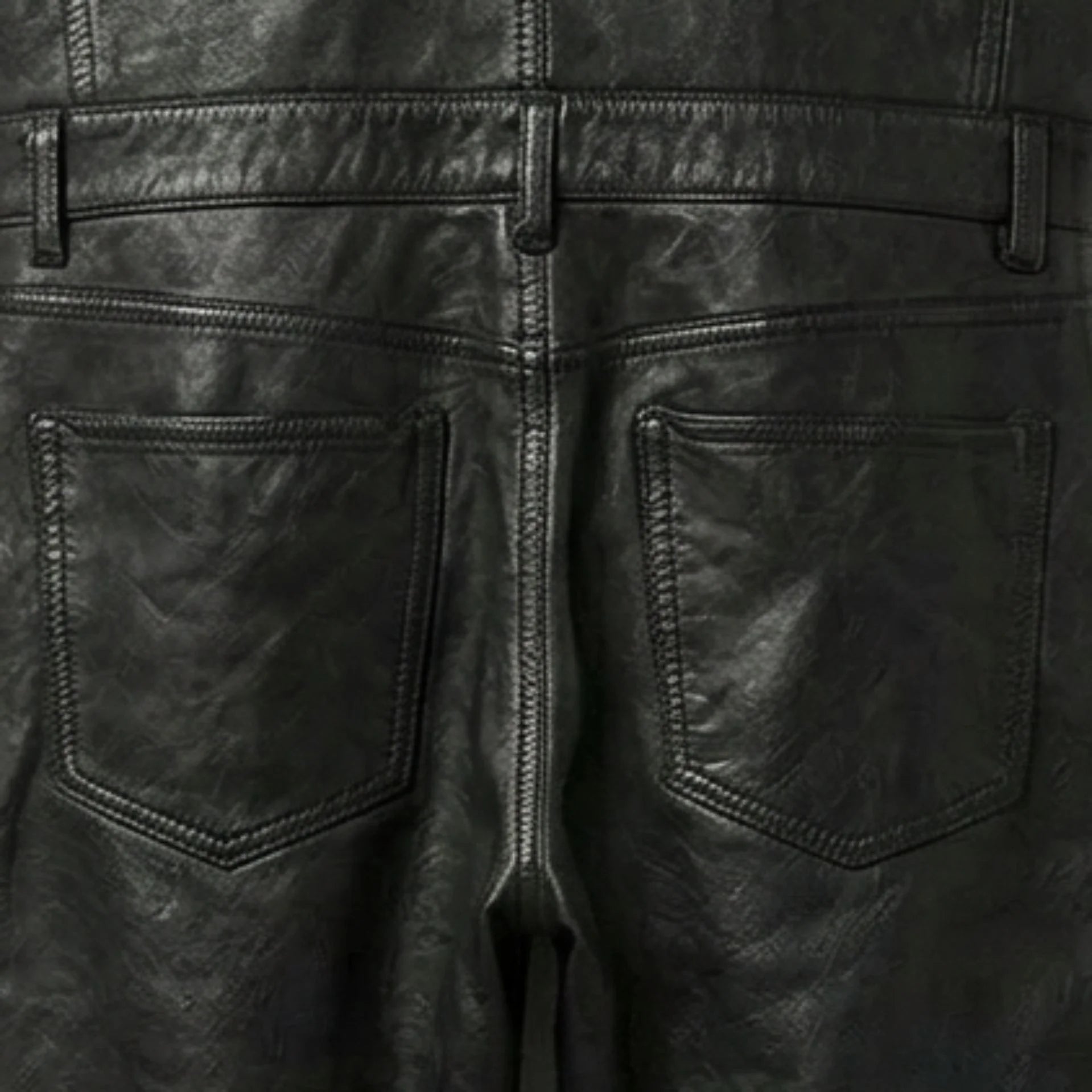 Back pocket and waistband detail on men's black leather overalls