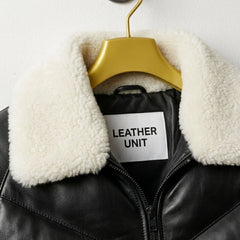 Close-up of luxurious fur collar and Leather Unit branding