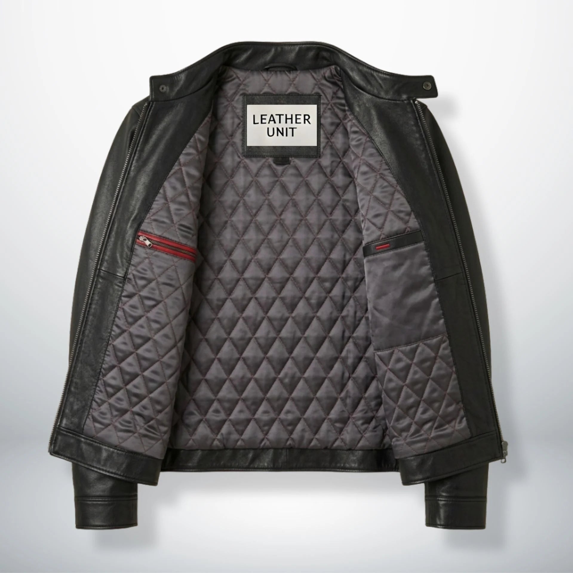 Interior of men's black moto leather jacket showing grey diamond quilted lining and inside pockets.