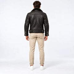 Rear model view of men’s black leather biker jacket showing shoulder quilting, back yoke and buckle waist tabs