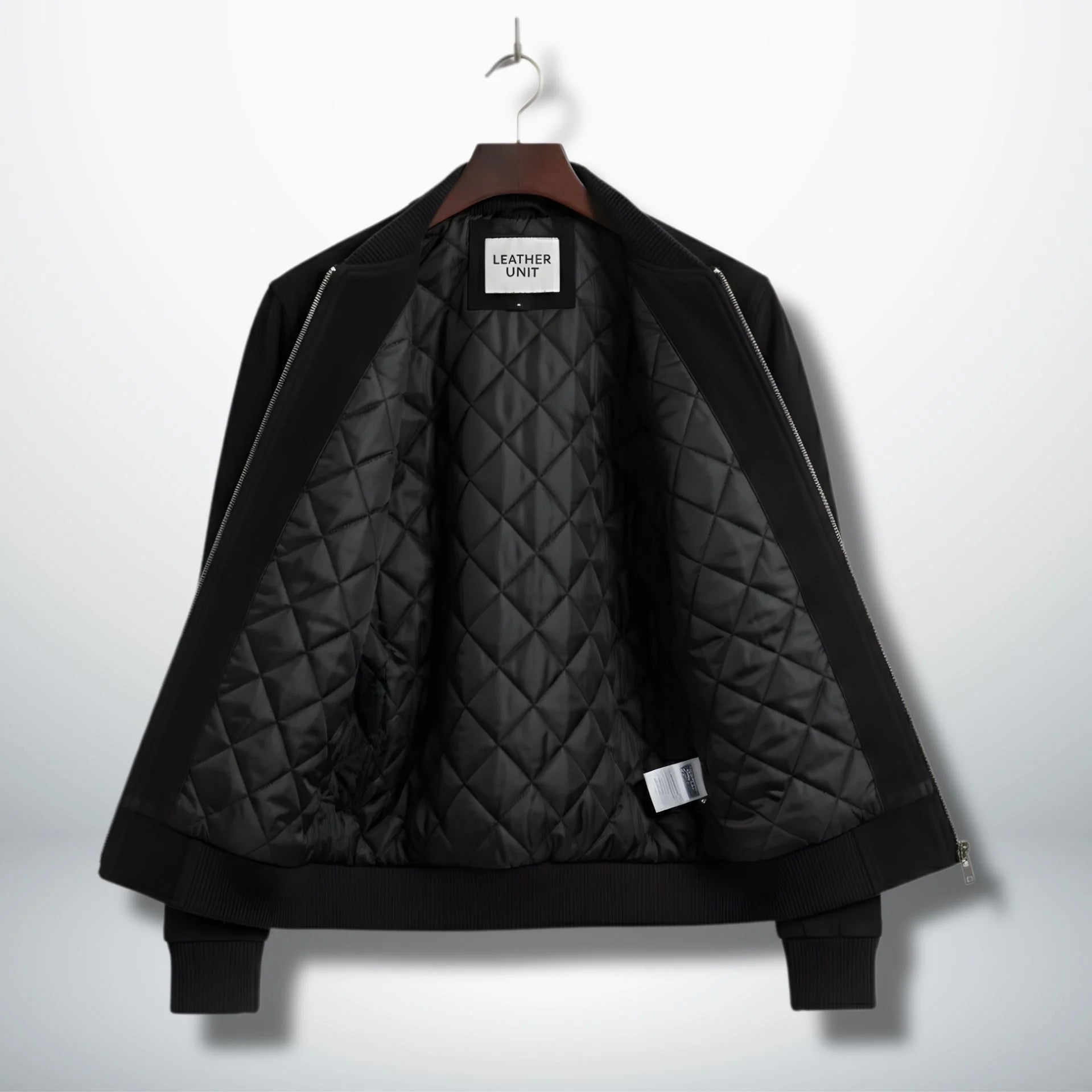 interior view black suede bomber jacket with diamond quilted lining.