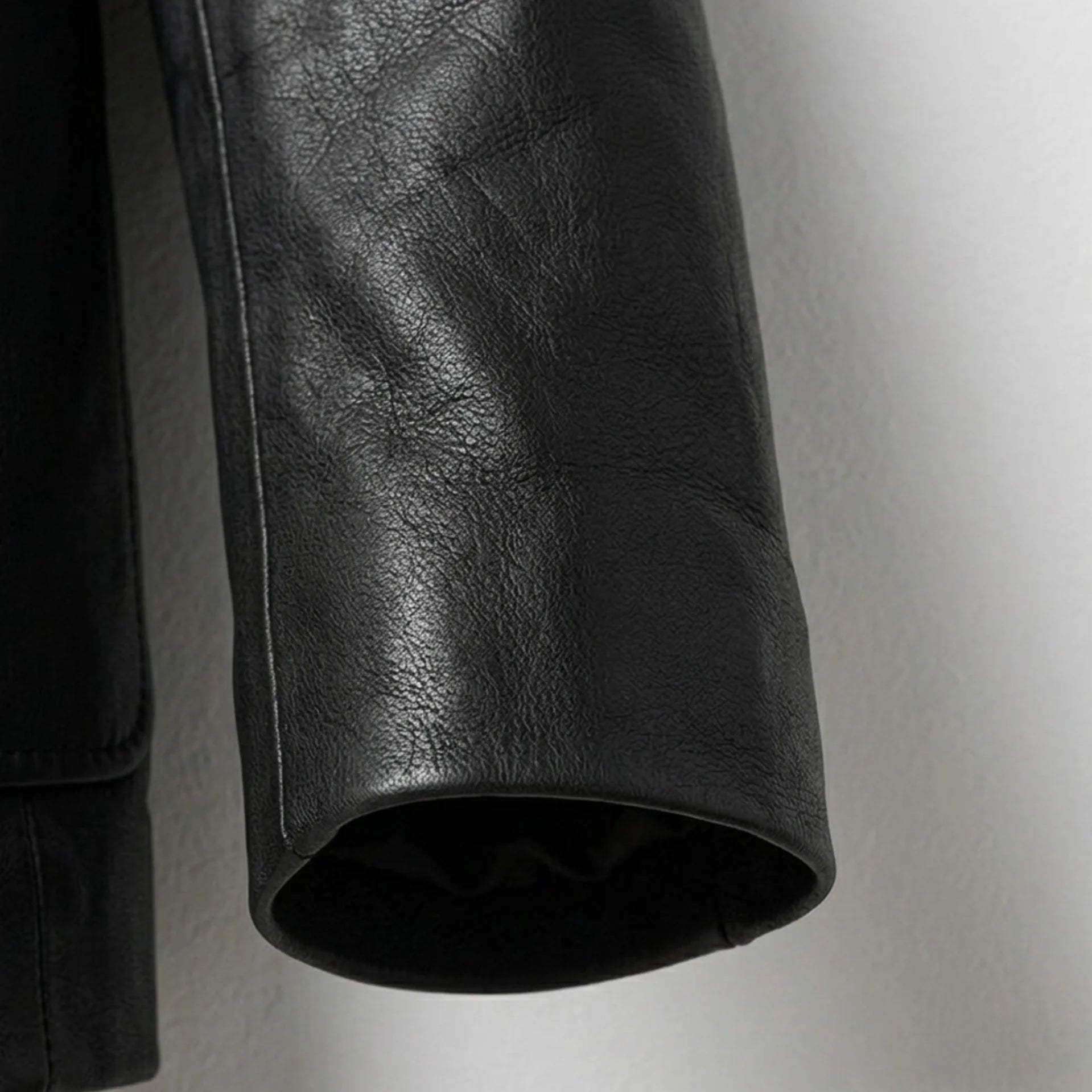 Sleeve detail on men’s black genuine leather blazer jacket