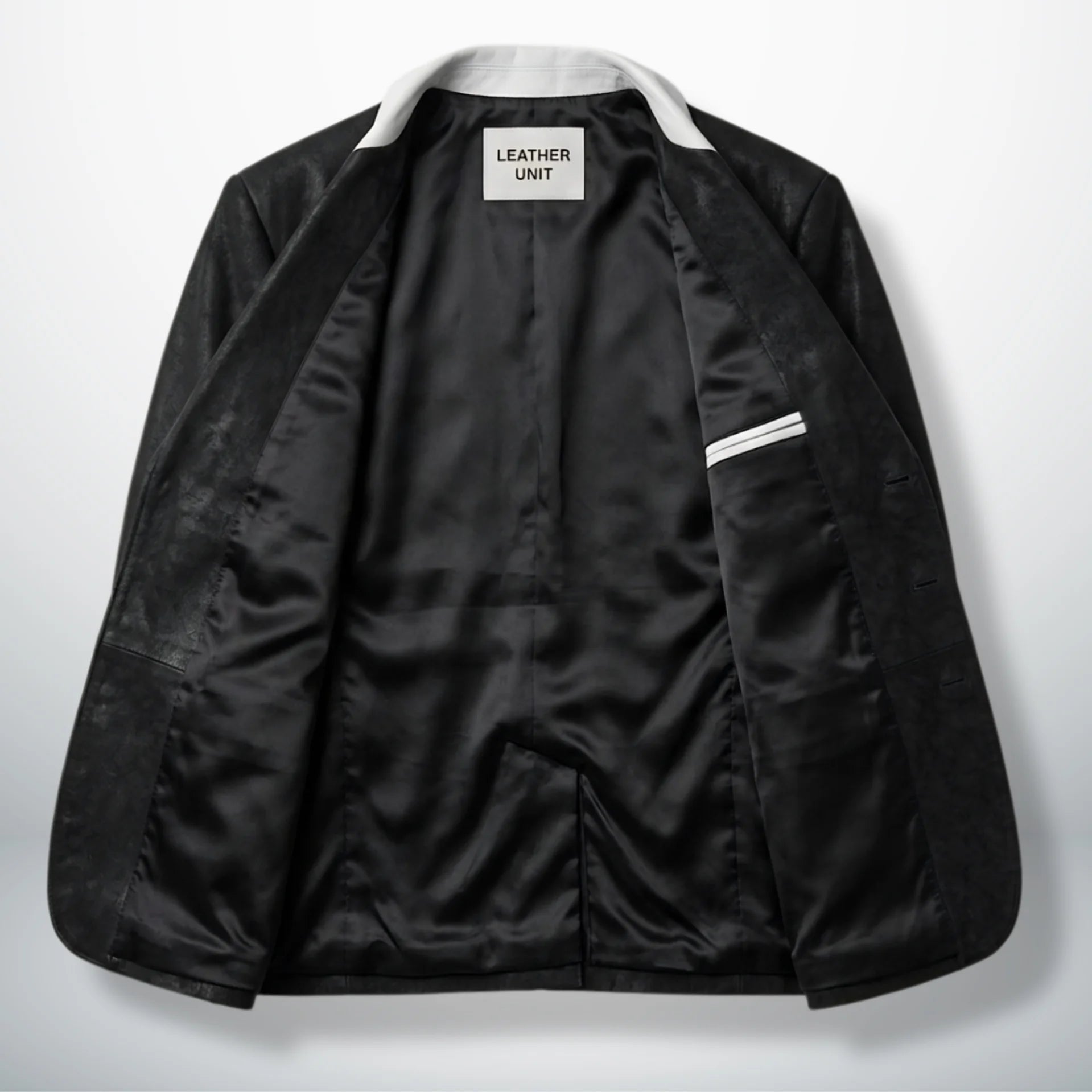 Inside lining of men’s black and white leather blazer showing interior pocket