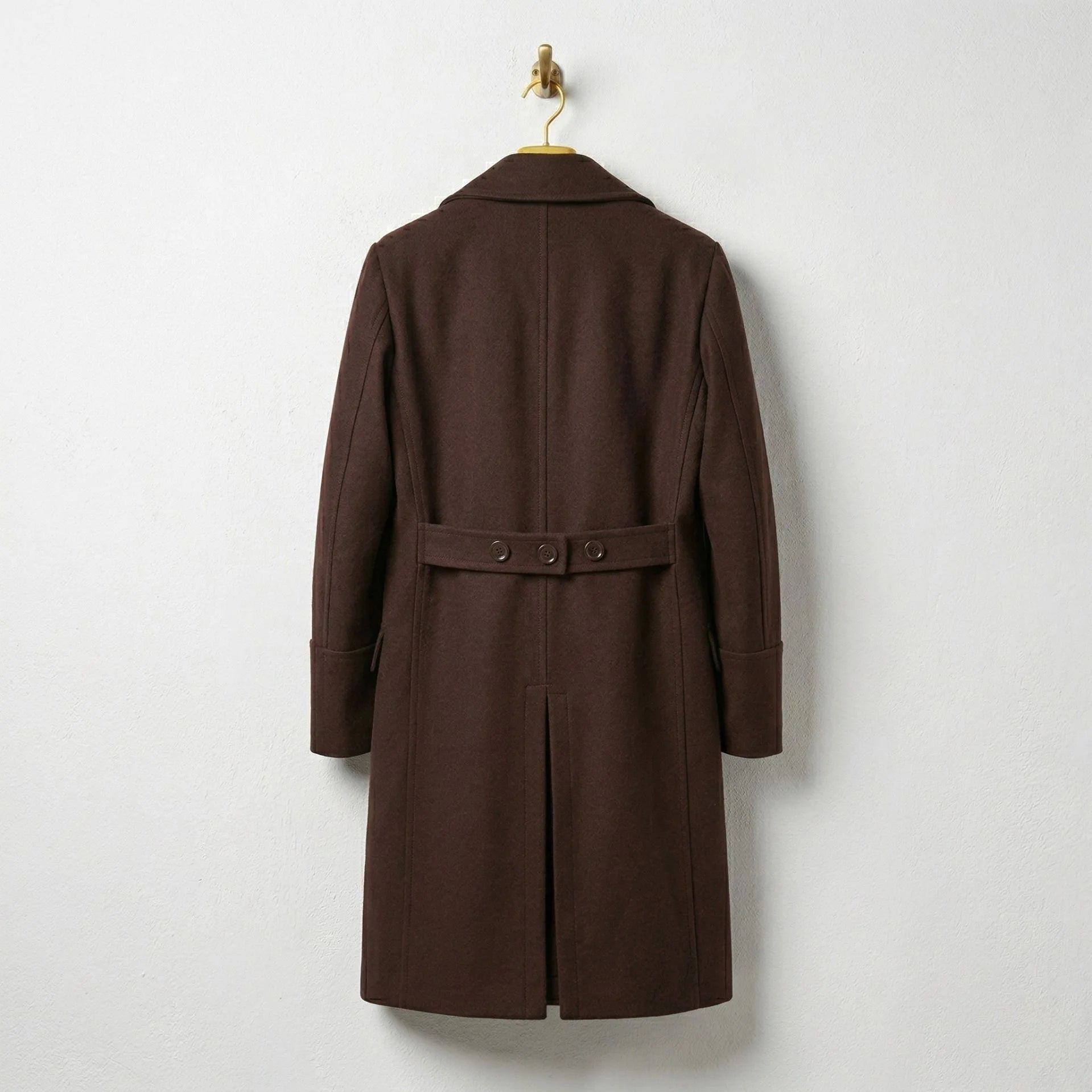 Back view of men's brown wool overcoat with half belt detail.