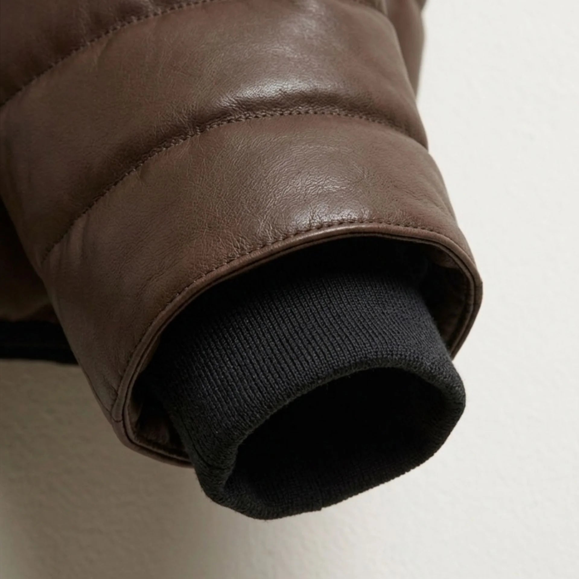 Detailed view of ribbed cuff and premium sheepskin leather texture