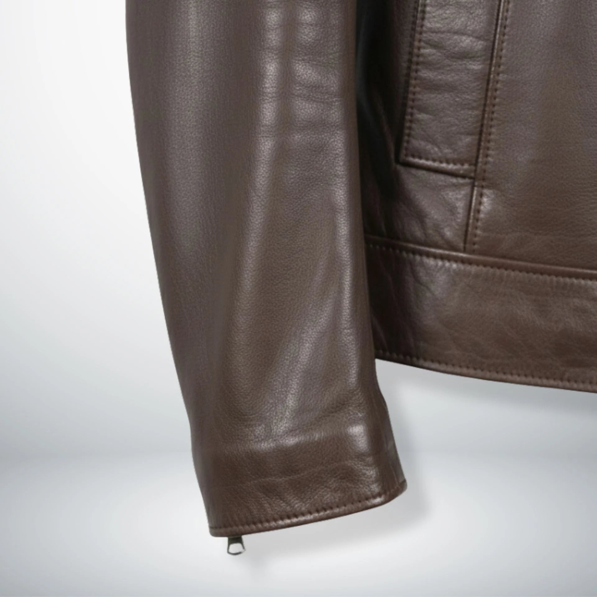 sleeve and cuff detail with zipper on men's brown leather biker jacket.