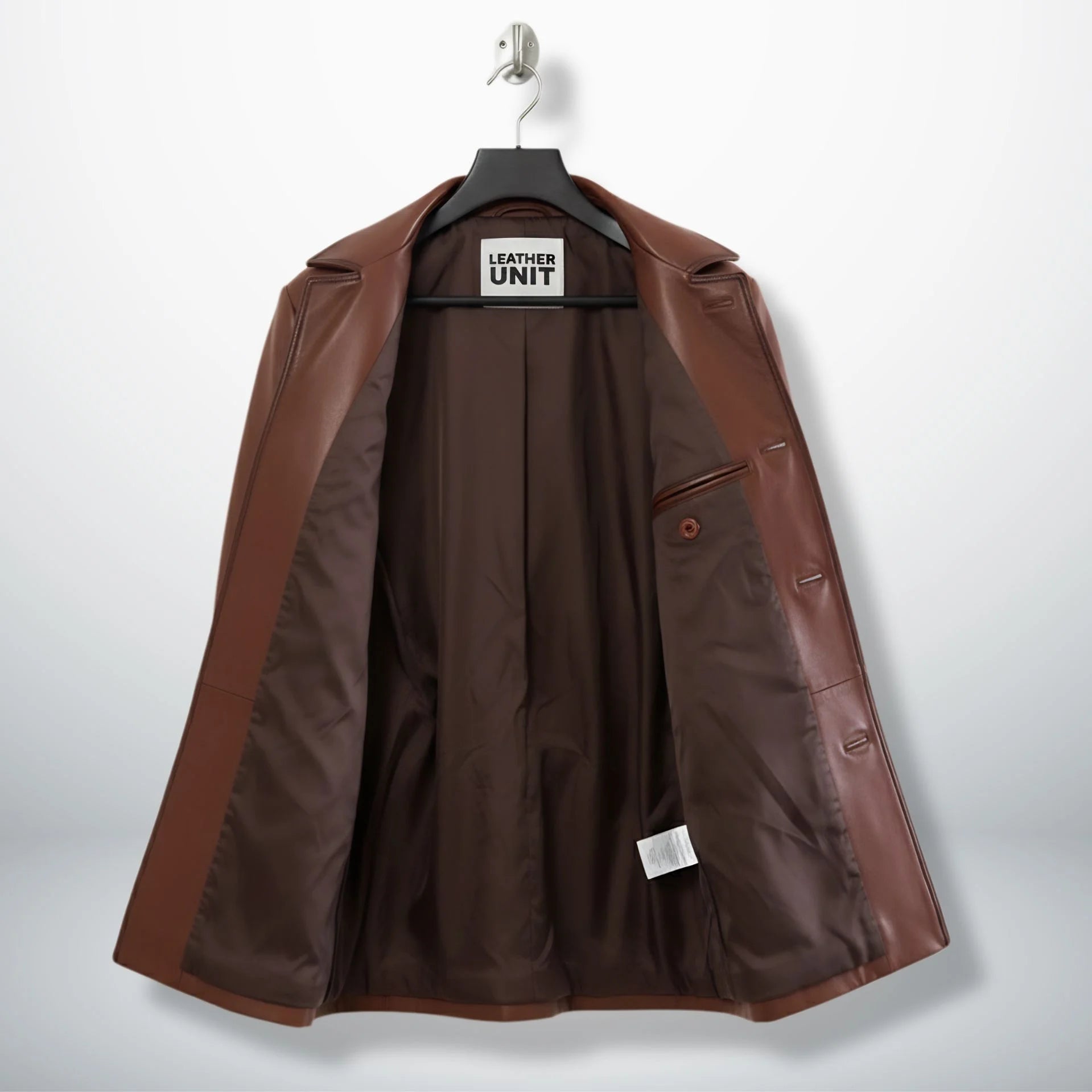 Inside lining of men’s brown leather blazer coat showing inner pocket