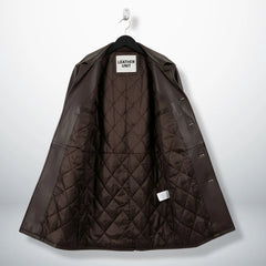 Interior of men's brown leather car coat showing diamond quilted lining.