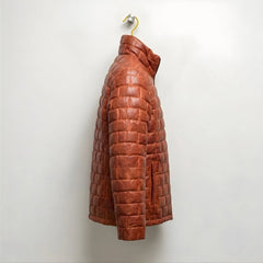 Side profile of men's brown leather padded jacket with stand collar.