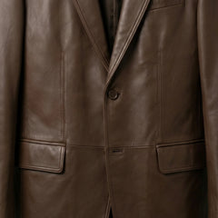 Button and flap pocket close up on men’s brown leather blazer jacket