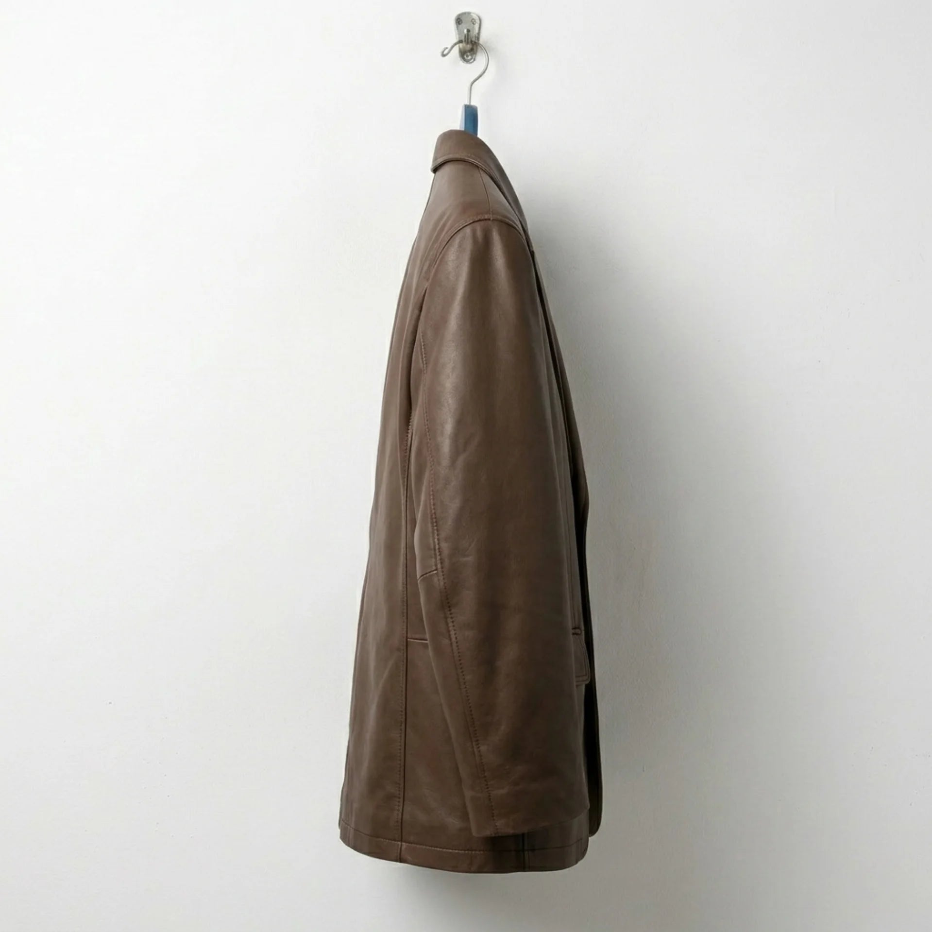 Side profile of mens brown single breasted leather blazer