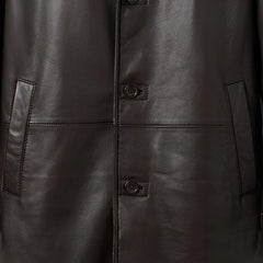 Button front and welt pockets on men’s dark brown shearling coat