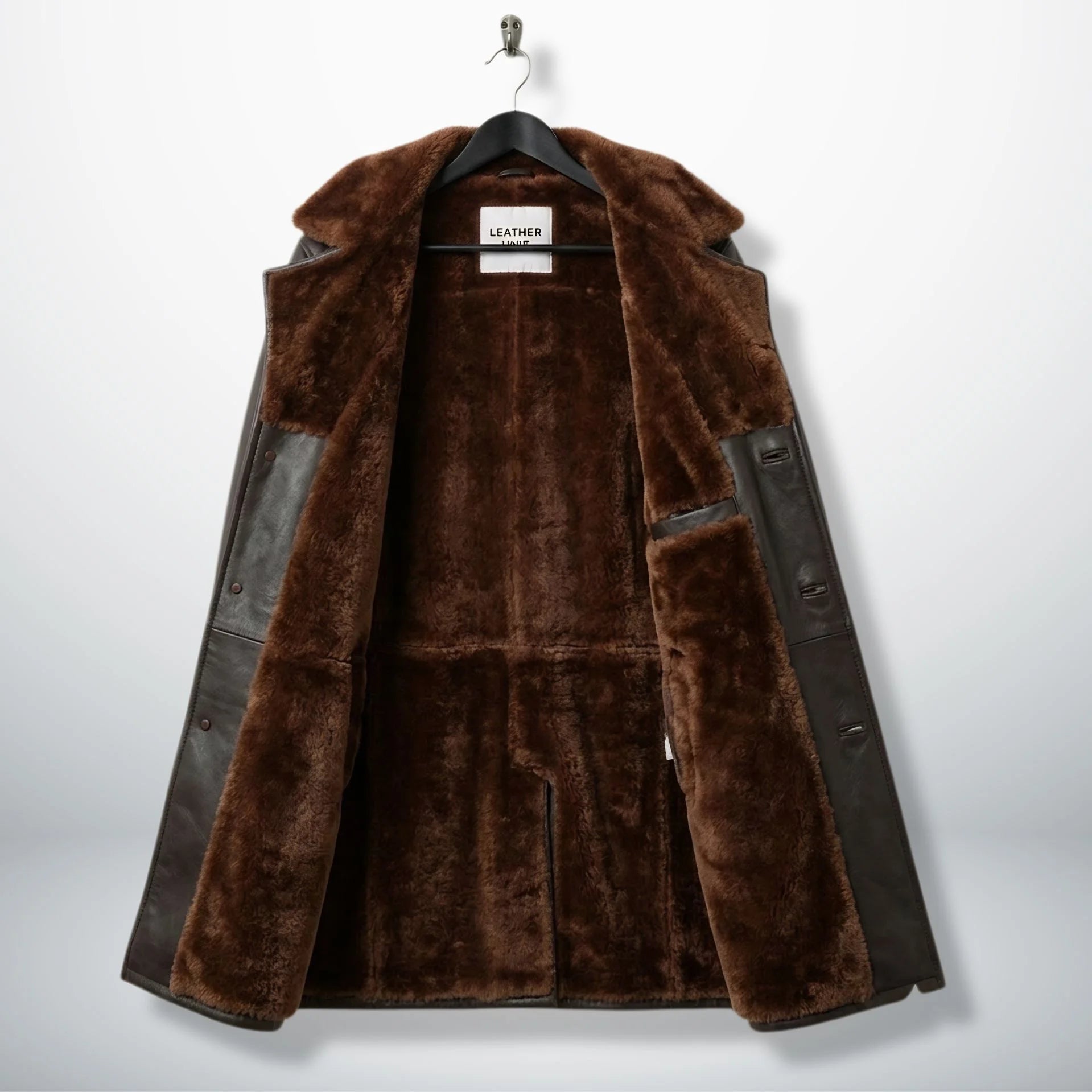 Inside of men’s dark brown shearling coat showing full fur lining