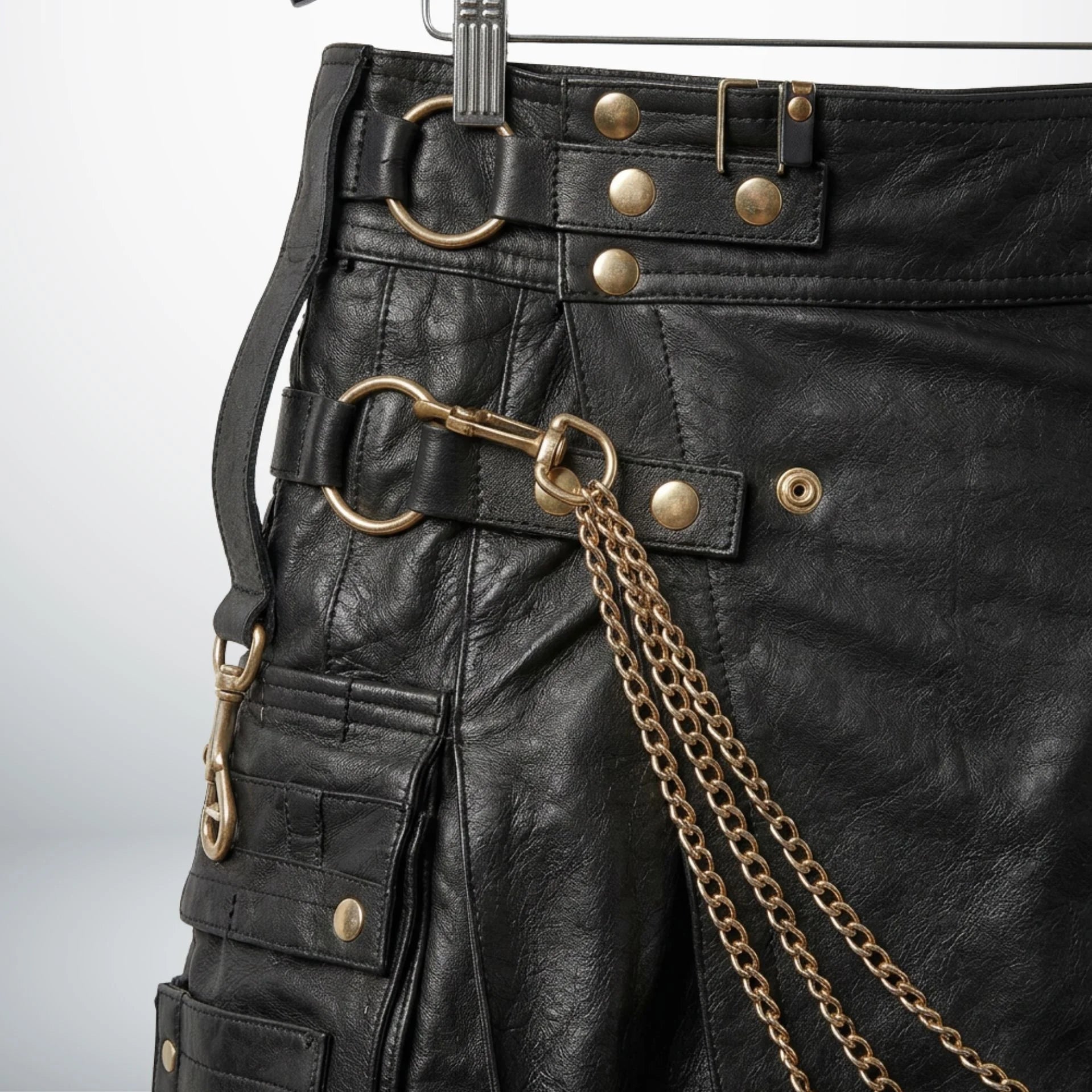 Close-up of side D-rings, chains and utility pocket on men's leather kilt