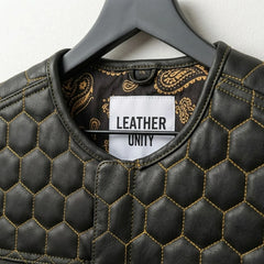 Close-up of honeycomb quilting and Leather Unit label on black leather vest