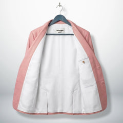 Inside white lining of men’s light pink leather blazer showing pockets