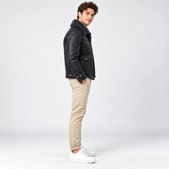 Side profile of men’s navy leather flight jacket showing faux fur collar, patch pocket and adjustable cuff