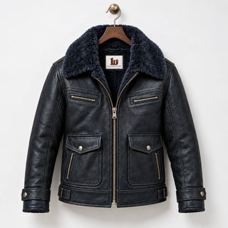 Front hanger view of navy sheepskin flight jacket with faux fur collar, chest zips and lower patch pockets