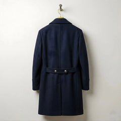 Back view of men's navy wool overcoat with buttoned half belt.