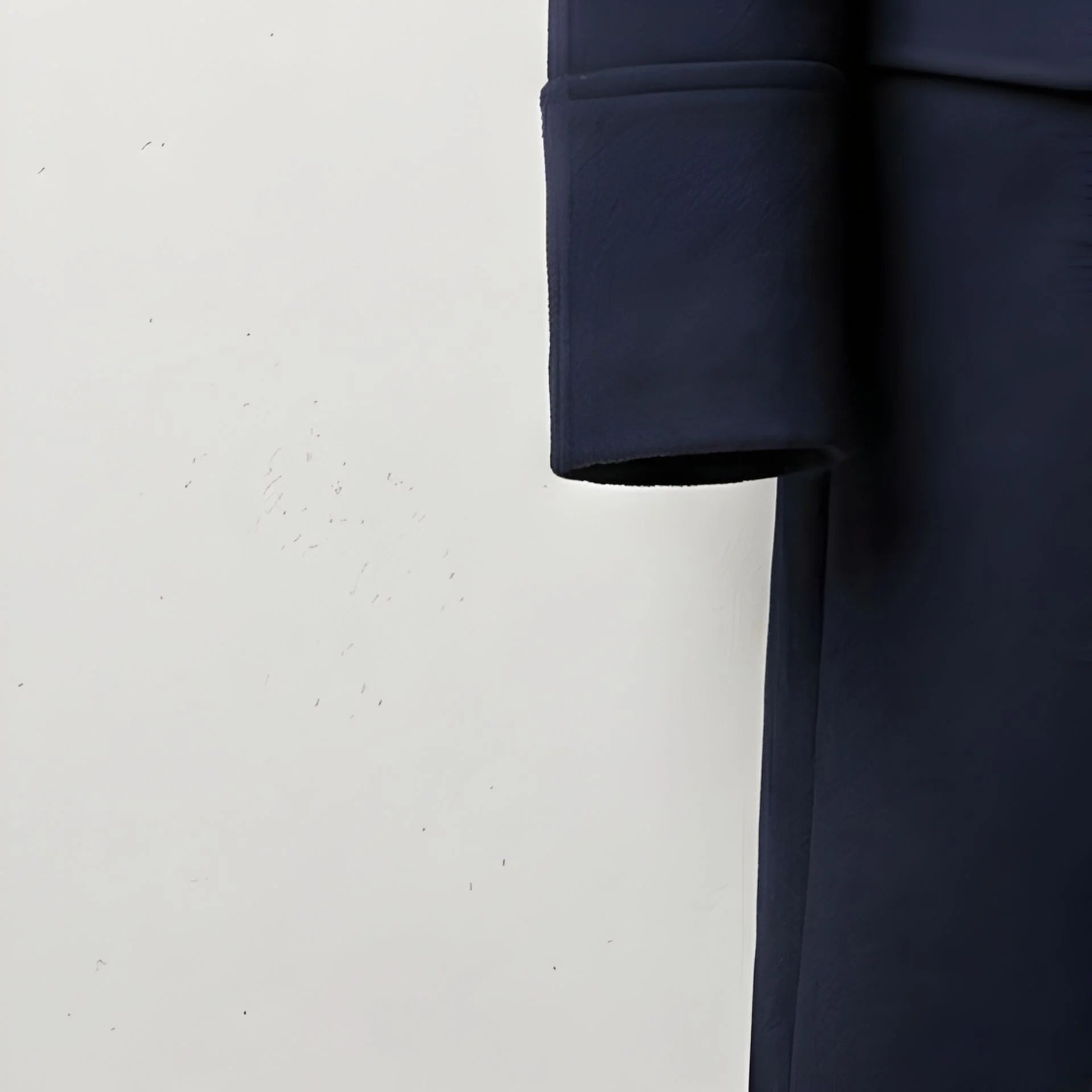 Detail of sleeve cuff on men's navy wool winter overcoat.