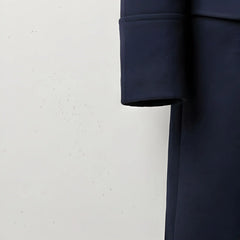 Detail of sleeve cuff on men's navy wool winter overcoat.