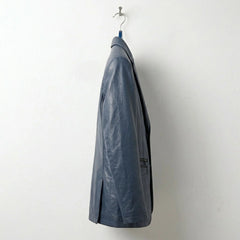 Side profile of men's navy leather blazer jacket with slim tailored fit.