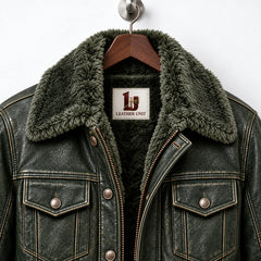 Close-up of olive green trucker jacket highlighting textured finish, faux fur collar and pockets