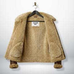 inside view mens pilot flying b3 jacket showing full tan faux shearling lining.