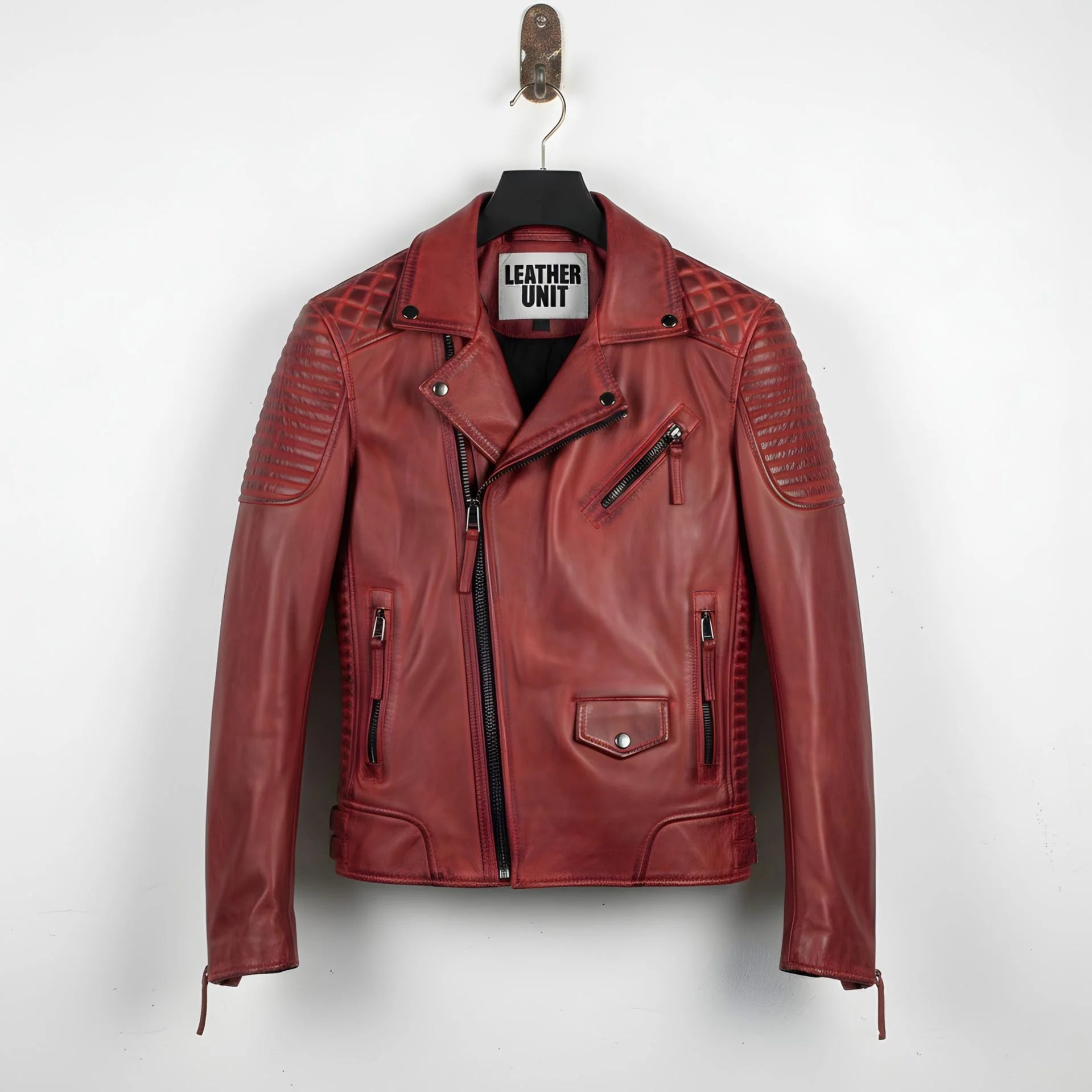 front view of men's red leather biker jacket with quilted shoulders.