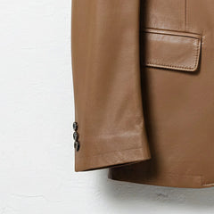 Sleeve cuff buttons on men’s tan brown leather blazer