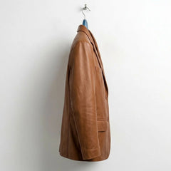 Side profile of men's tan leather blazer with tailored fit.