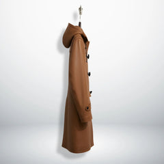 Side profile of men's tan leather duffle coat with hood and long length.