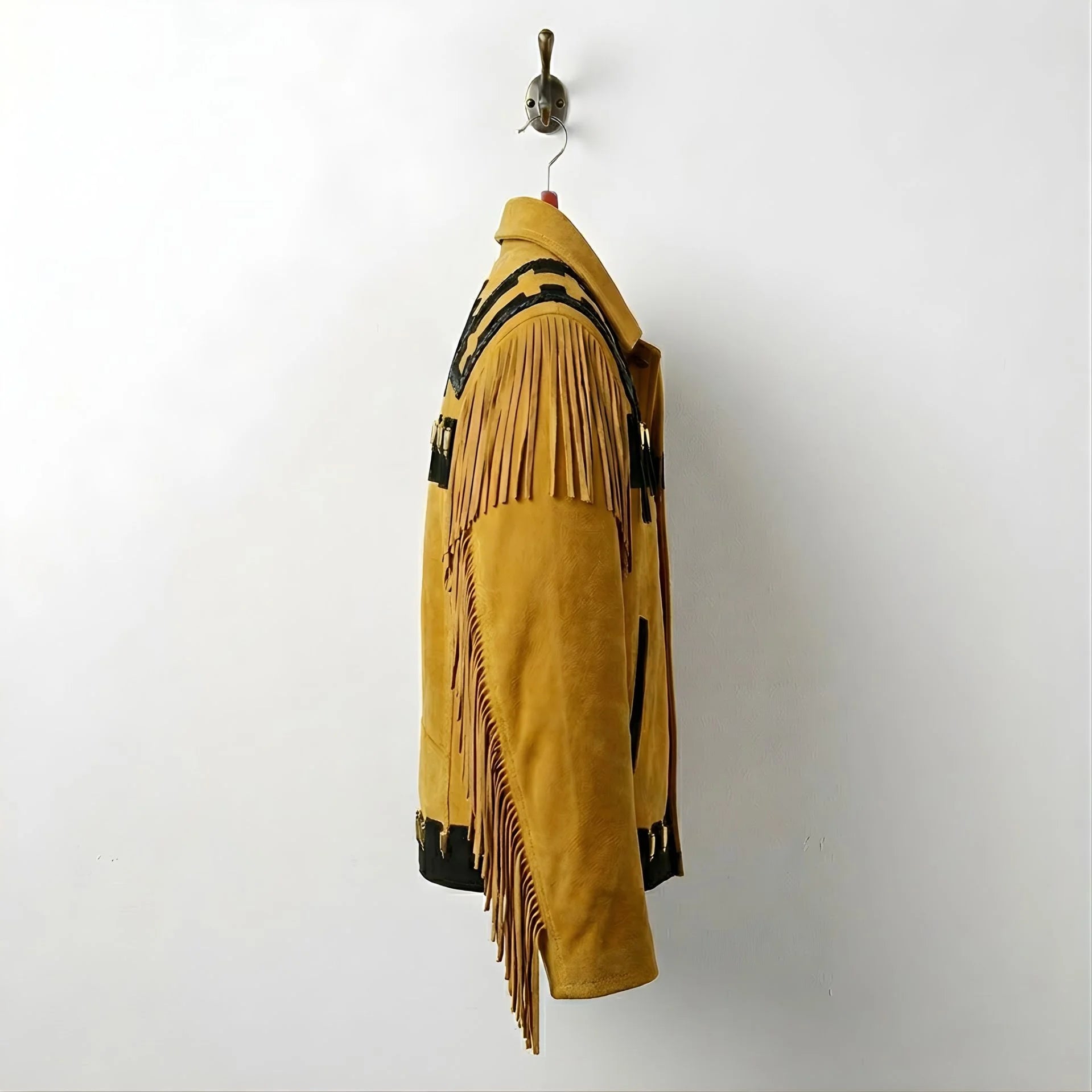 Side profile of men's tan suede western jacket with sleeve fringe.